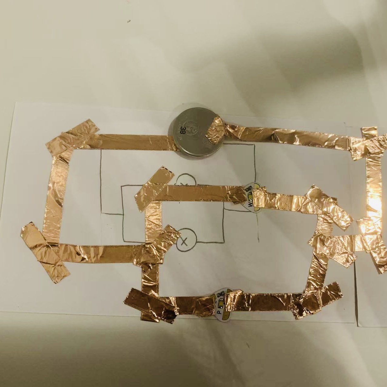 I built the circuit using copper tape, a battery, and LEDs, ensuring it closely follows my diagram.