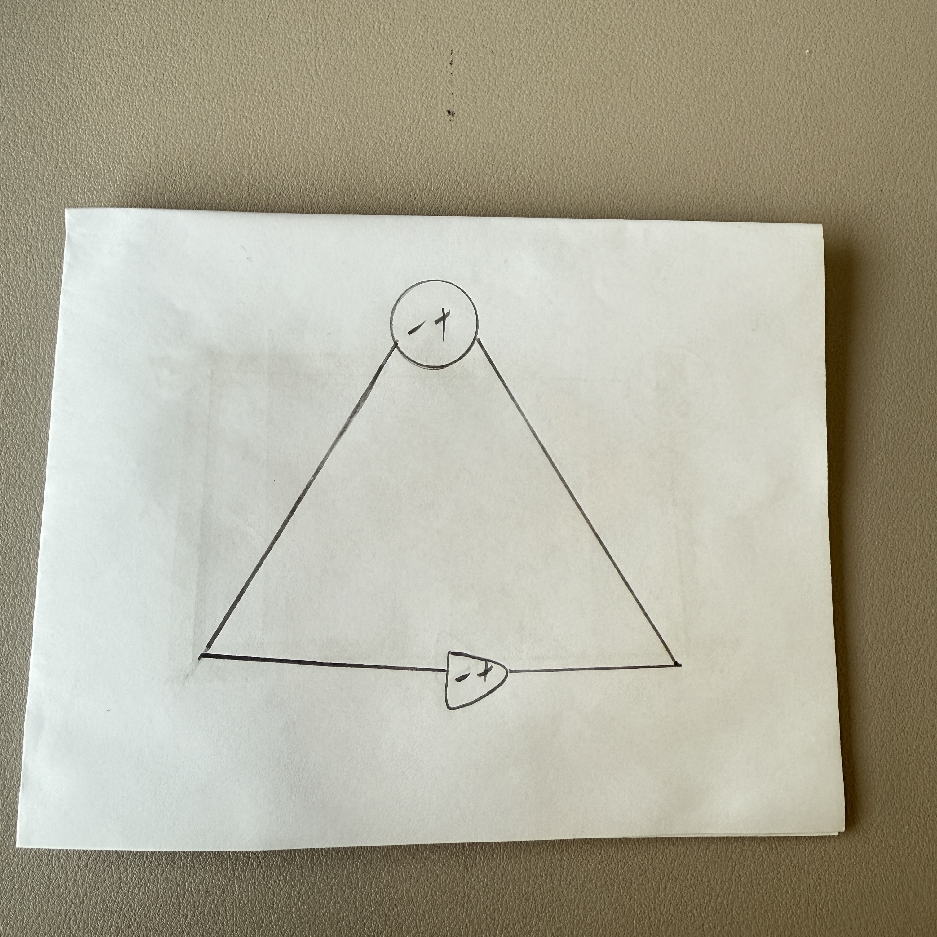 I built the triangular circuit using copper tape, carefully connecting the components according to my diagram. The layout is neat and well-organized.