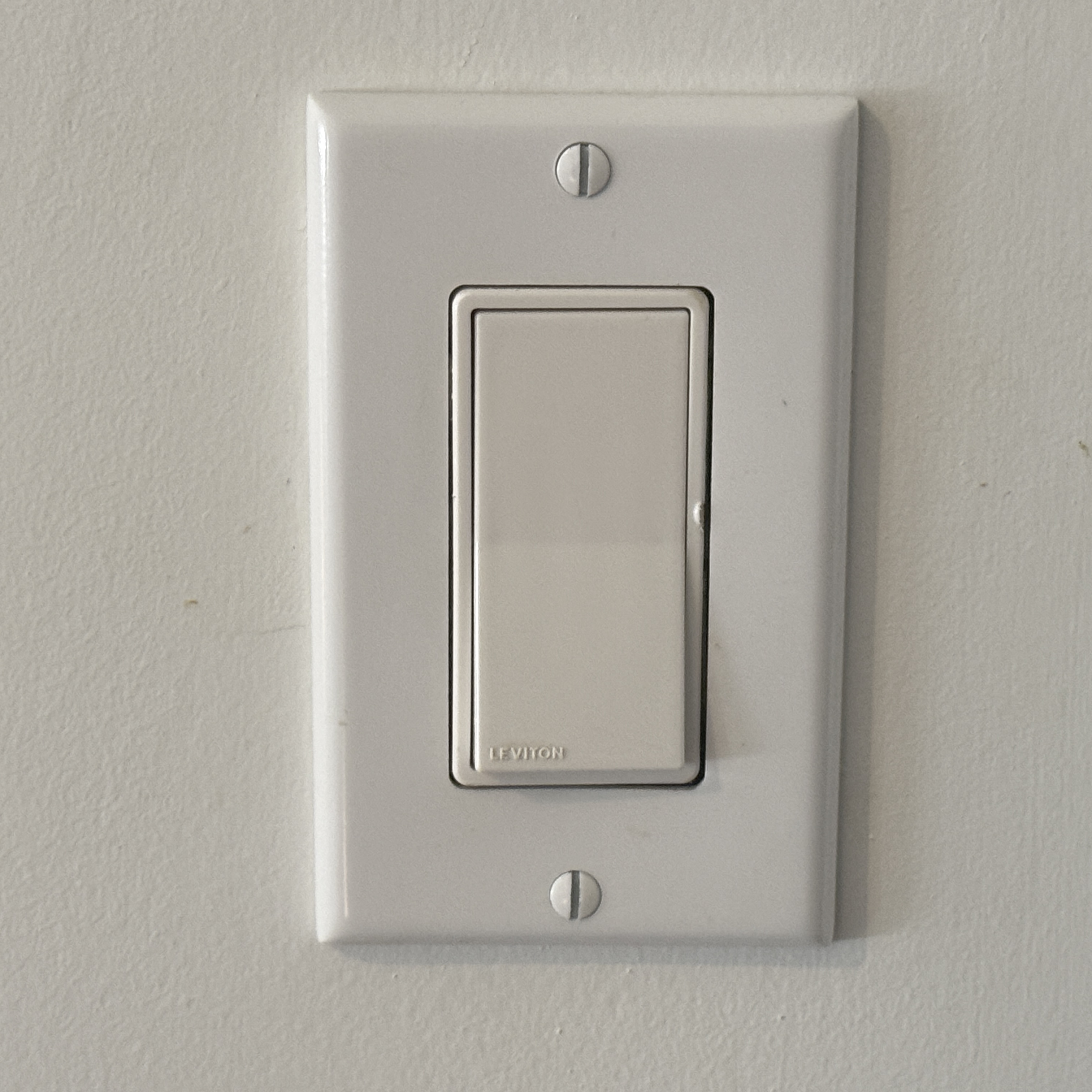The click sound when turning a light switch on or off.