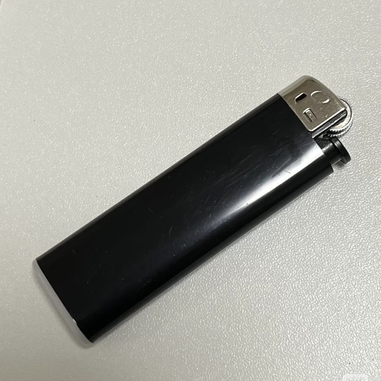 The click and ignition sound when pressing and lighting a lighter. 