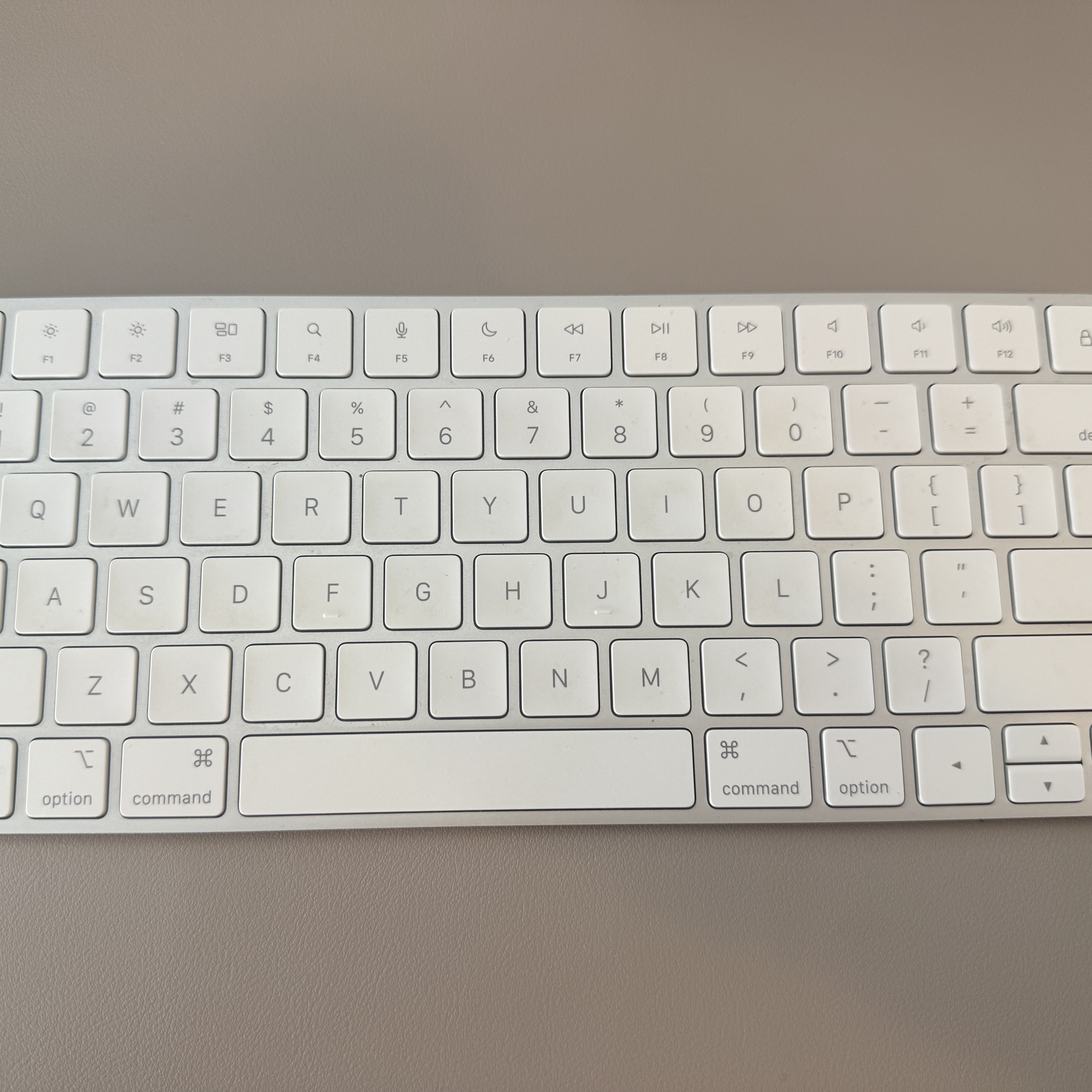 The click-clack sound of fingers pressing keyboard keys.