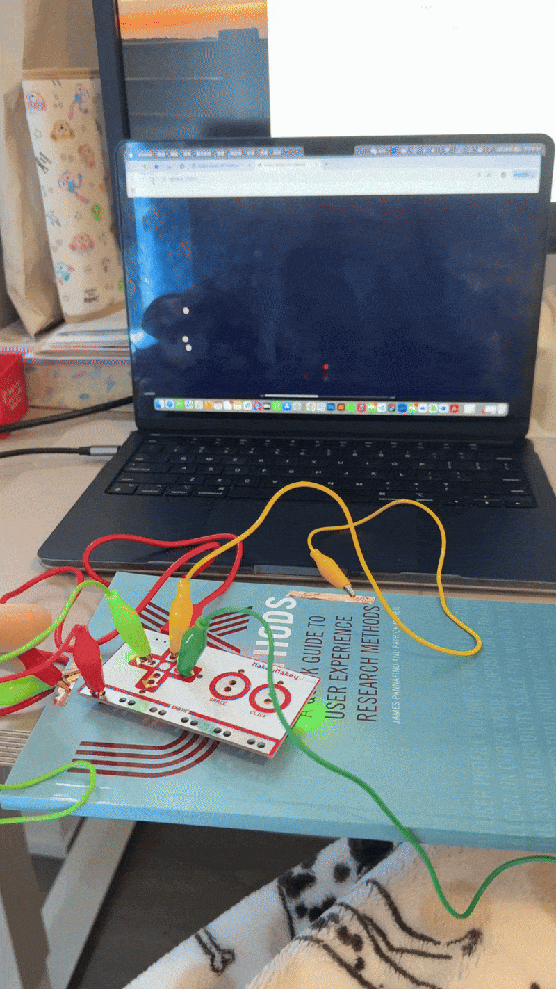 The animation responds to touch input using Makey Makey. When triggered, visual patterns pulse across the screen, showcasing an abstract light interaction.